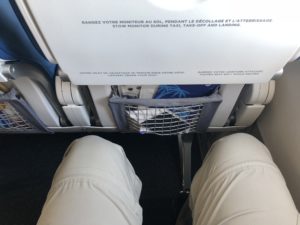 a person's legs in a seat