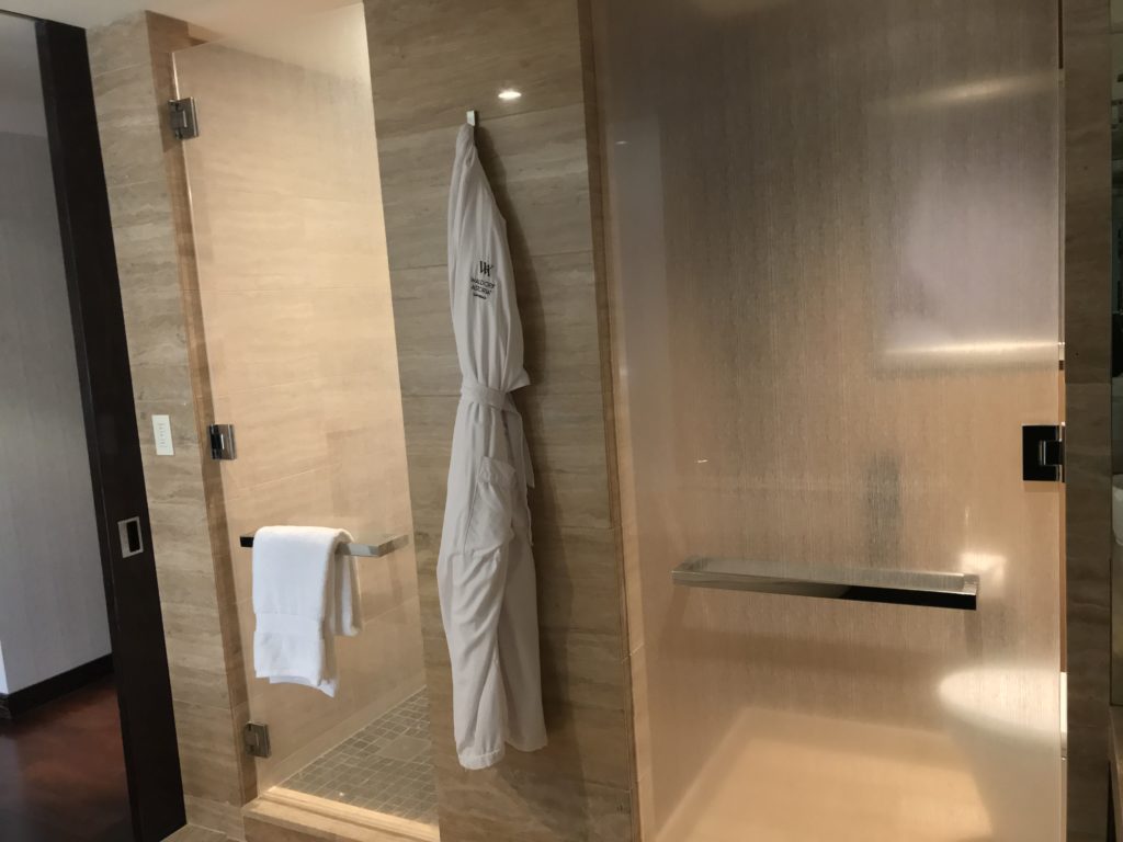a white robe on a shower