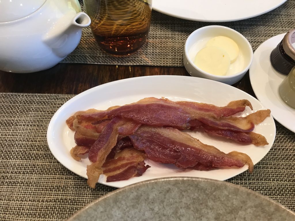 a plate of bacon on a table