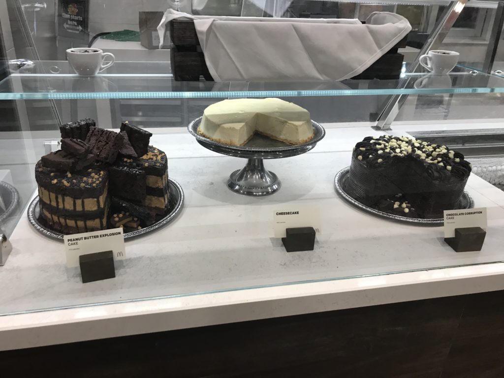 a display case with different cakes