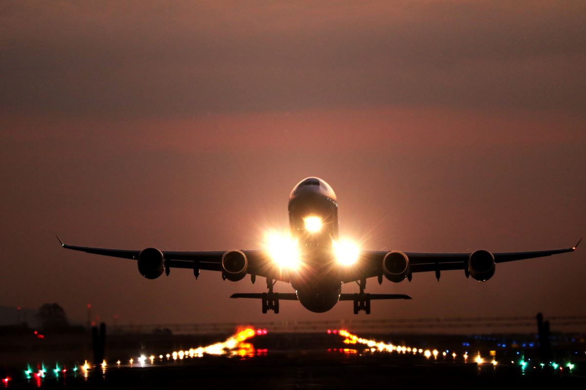 an airplane taking off at night