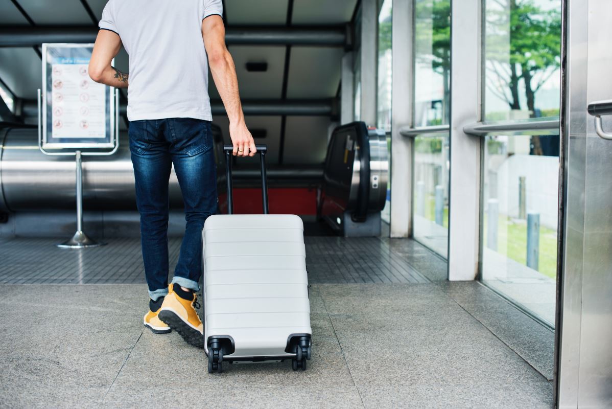 a man pulling a luggage