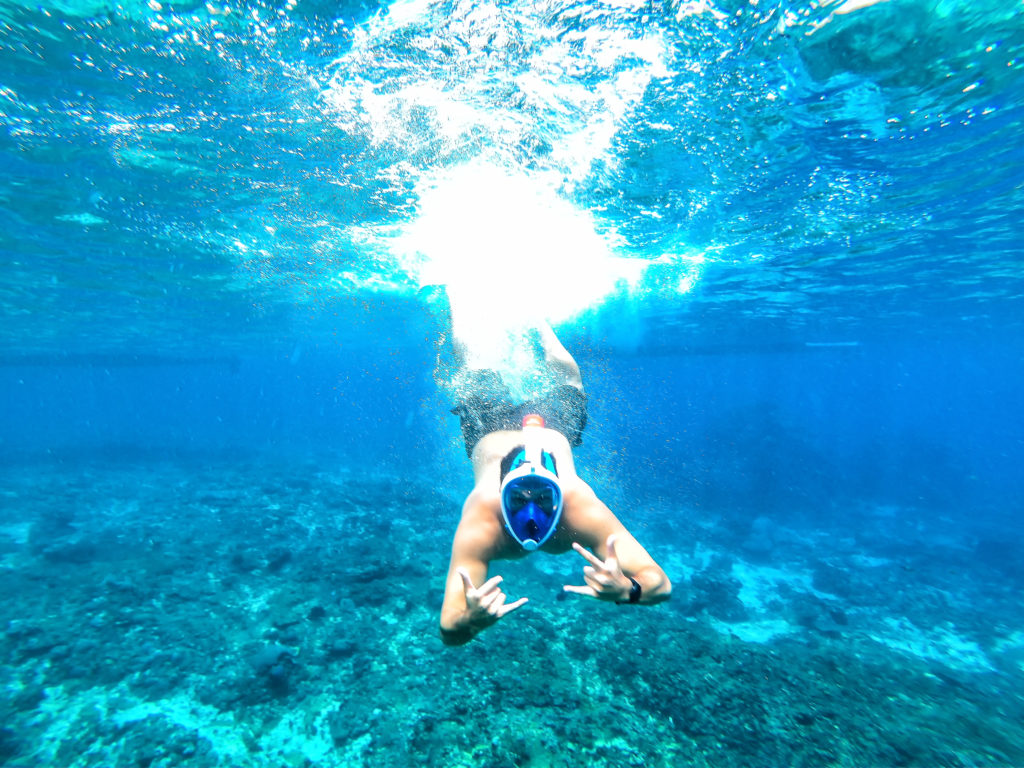 a man in a mask underwater