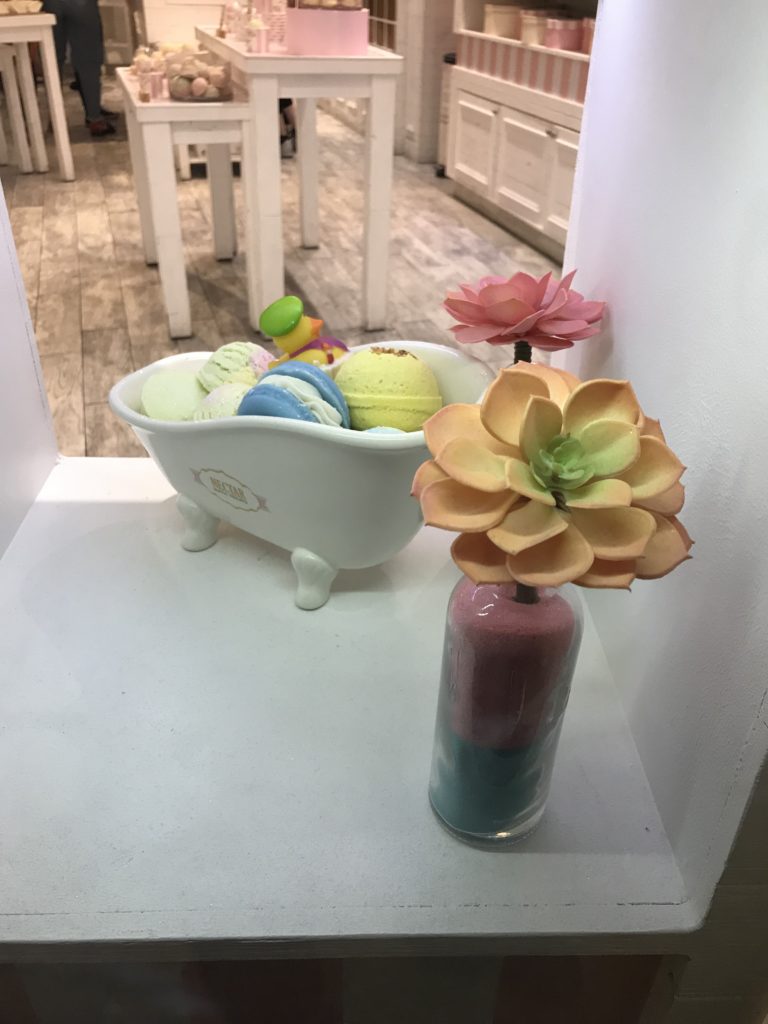 a bathtub with a flower in it