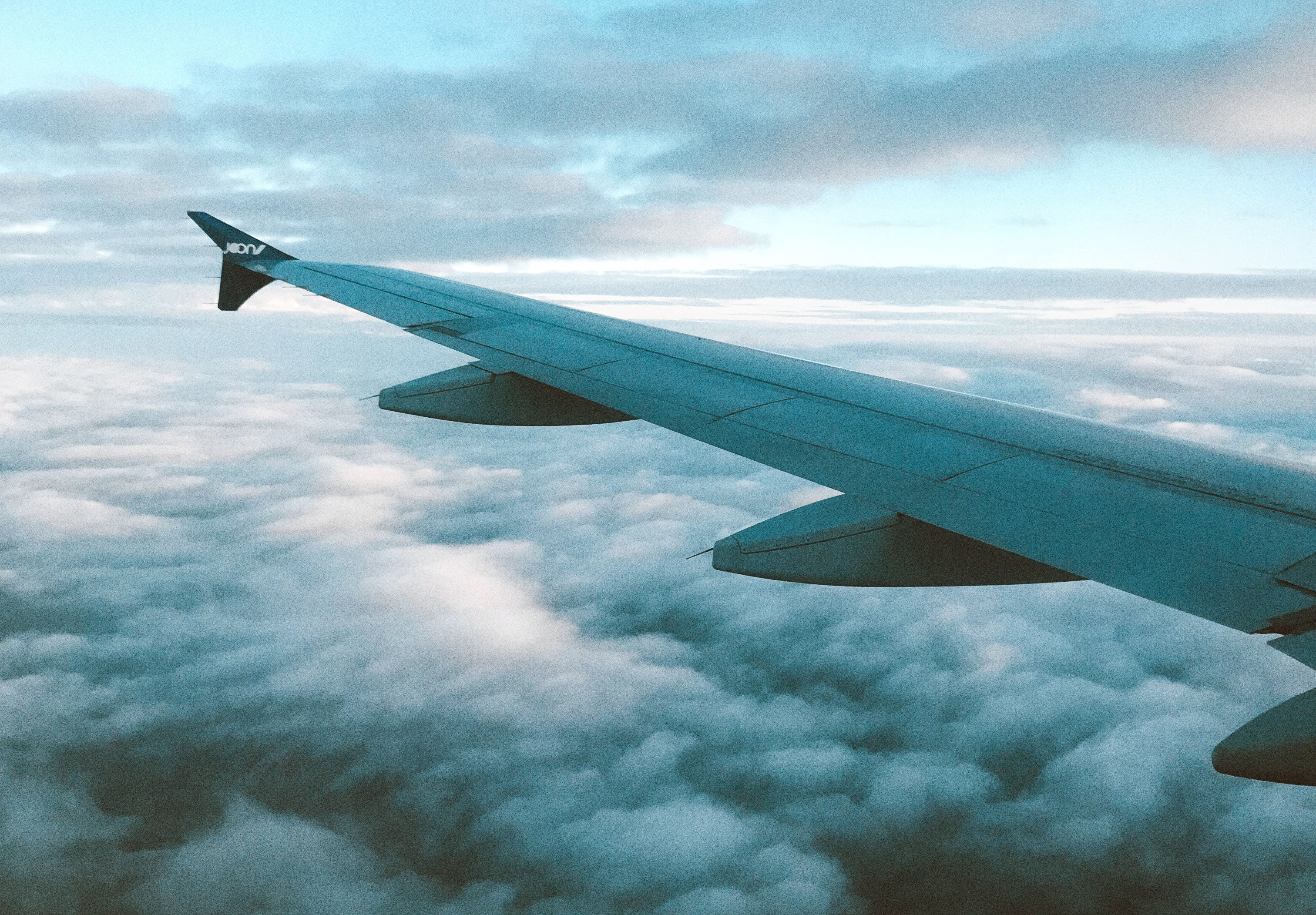 an airplane wing in the sky