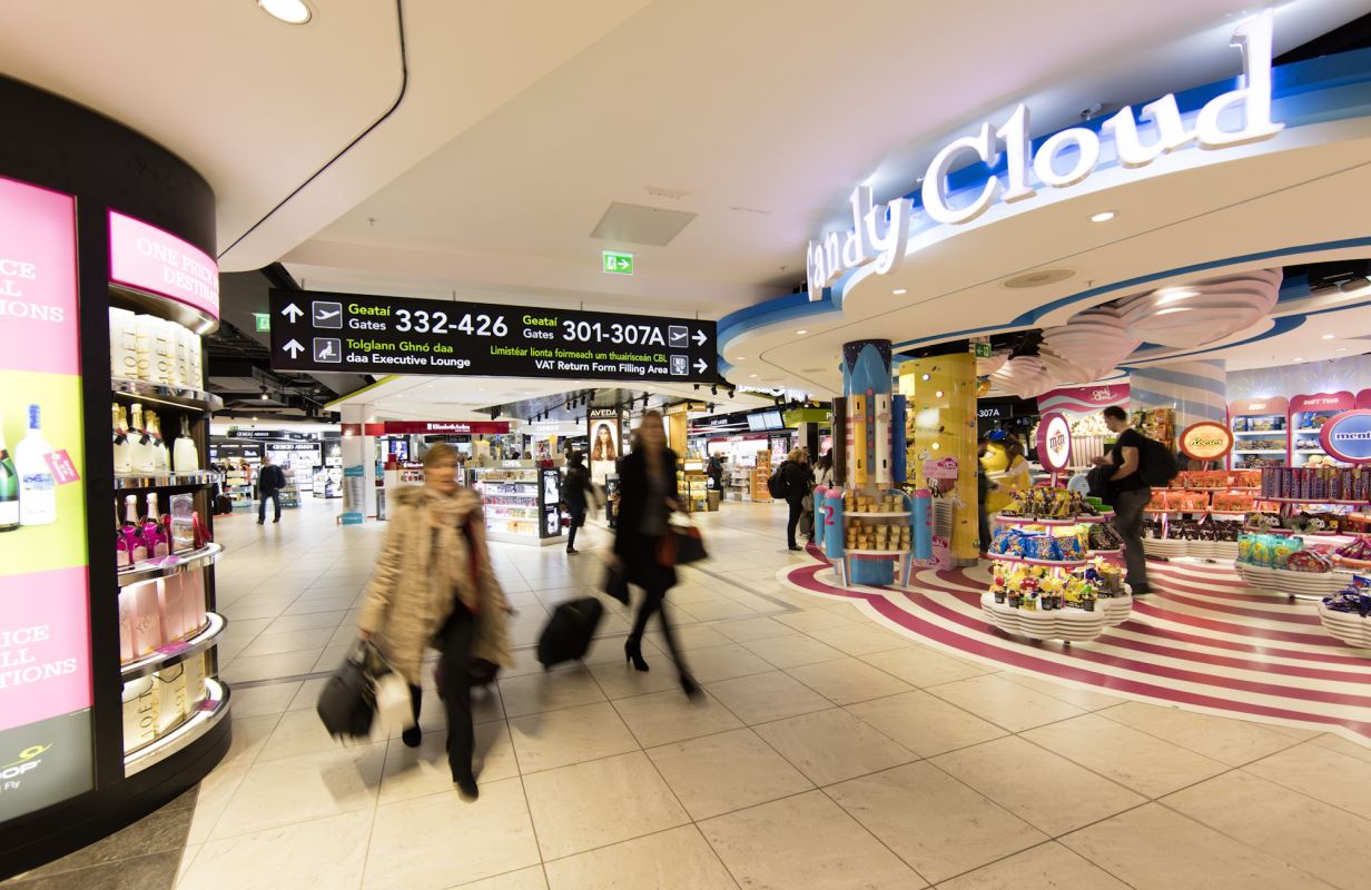 people walking in a large airport