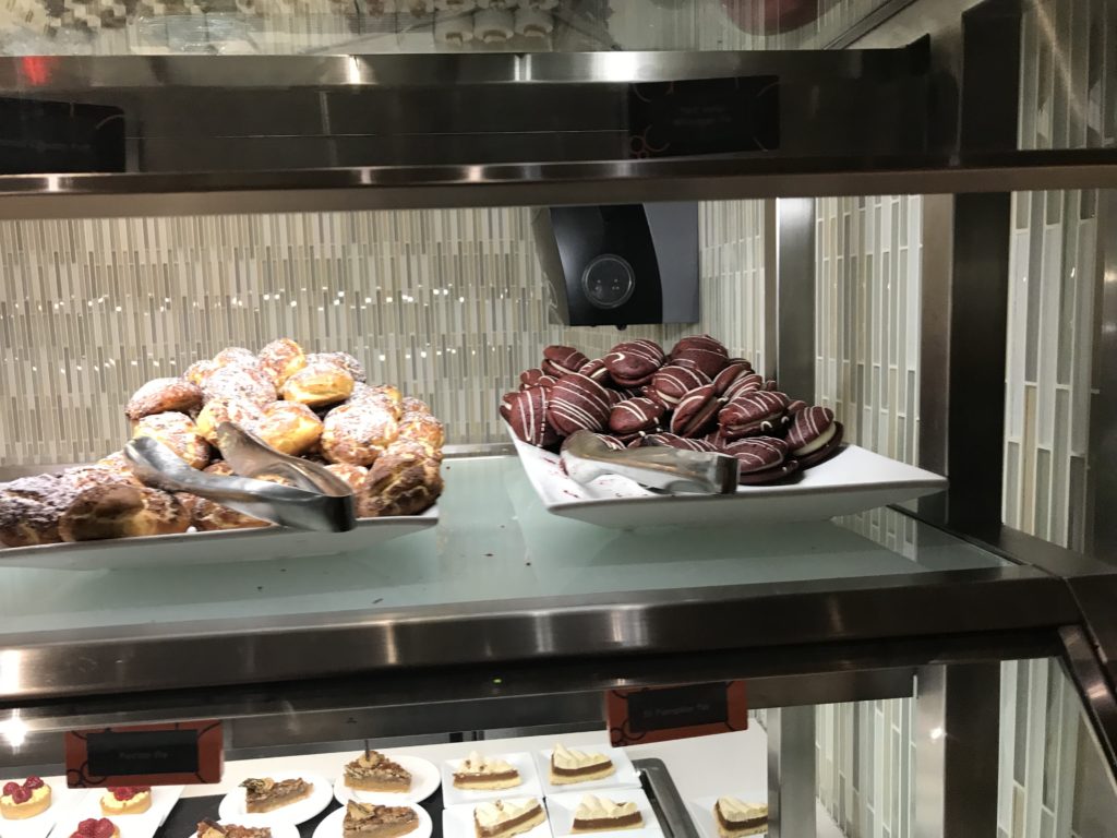 a display case with pastries and desserts