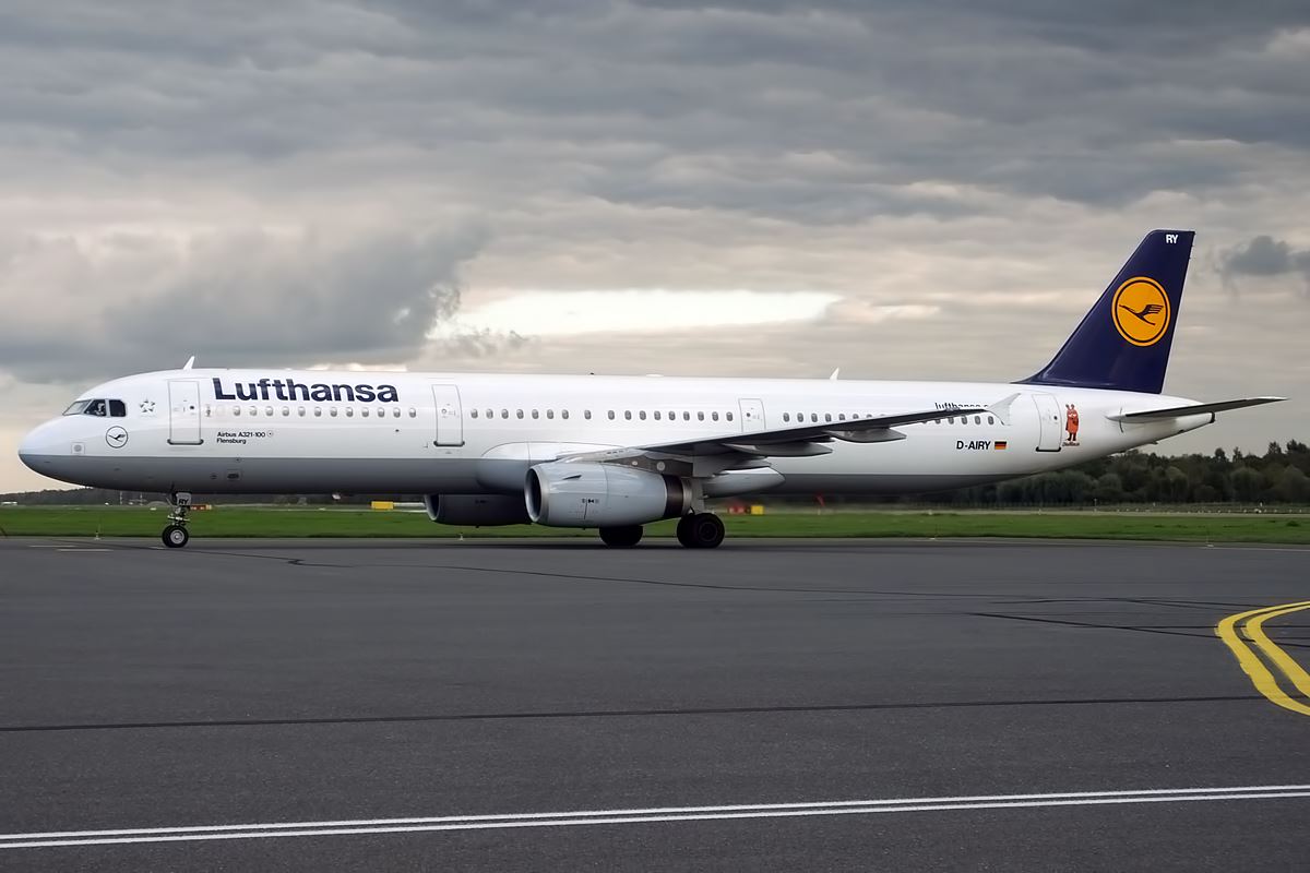 a white airplane on a runway