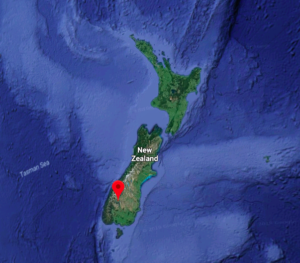 a map of new zealand with a red location