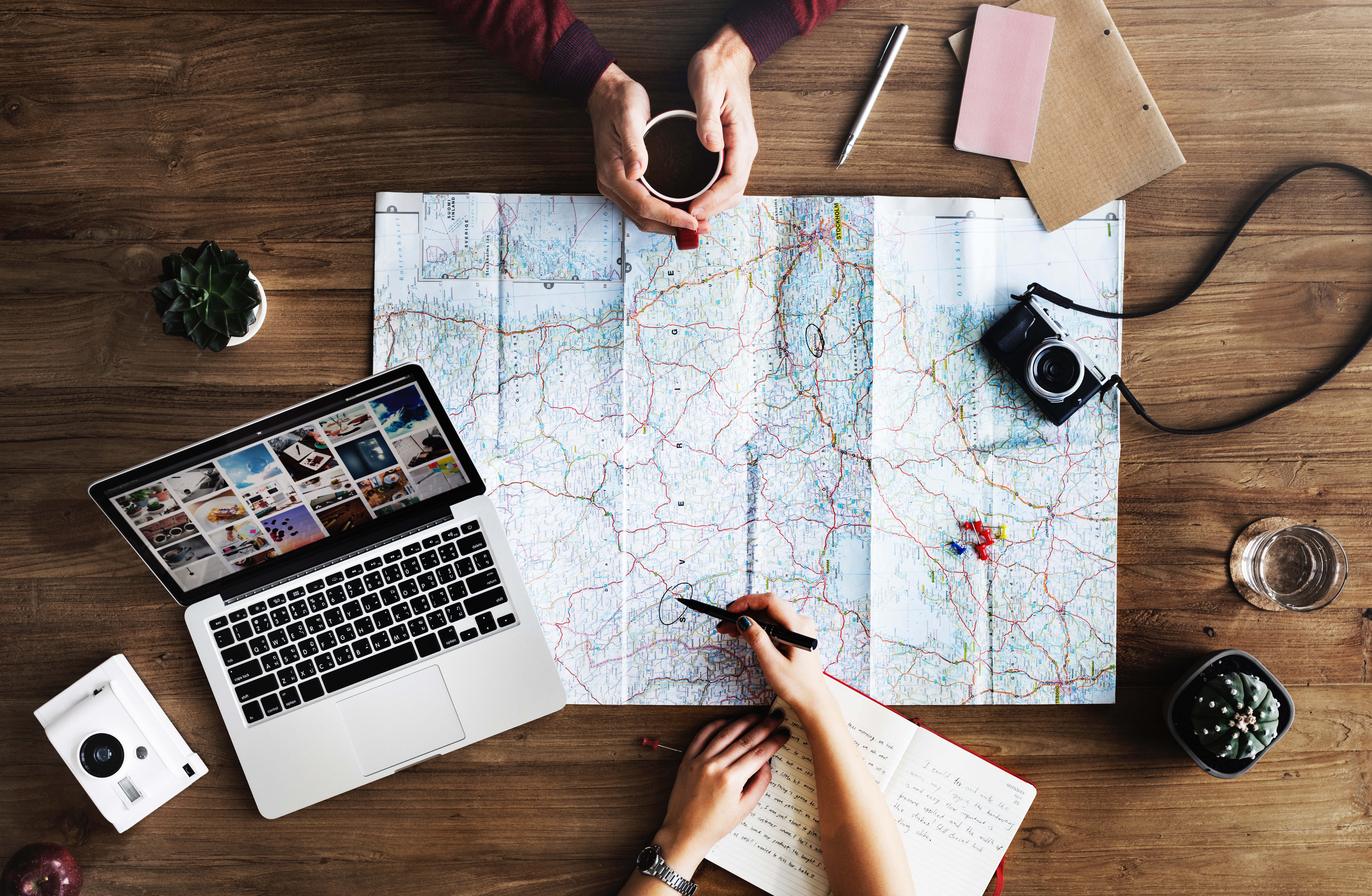 a group of people sitting around a map