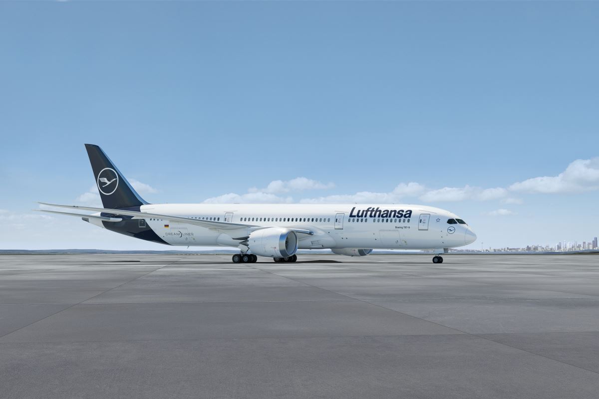 a white airplane on a runway