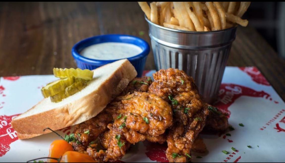 a plate of fried chicken and fries