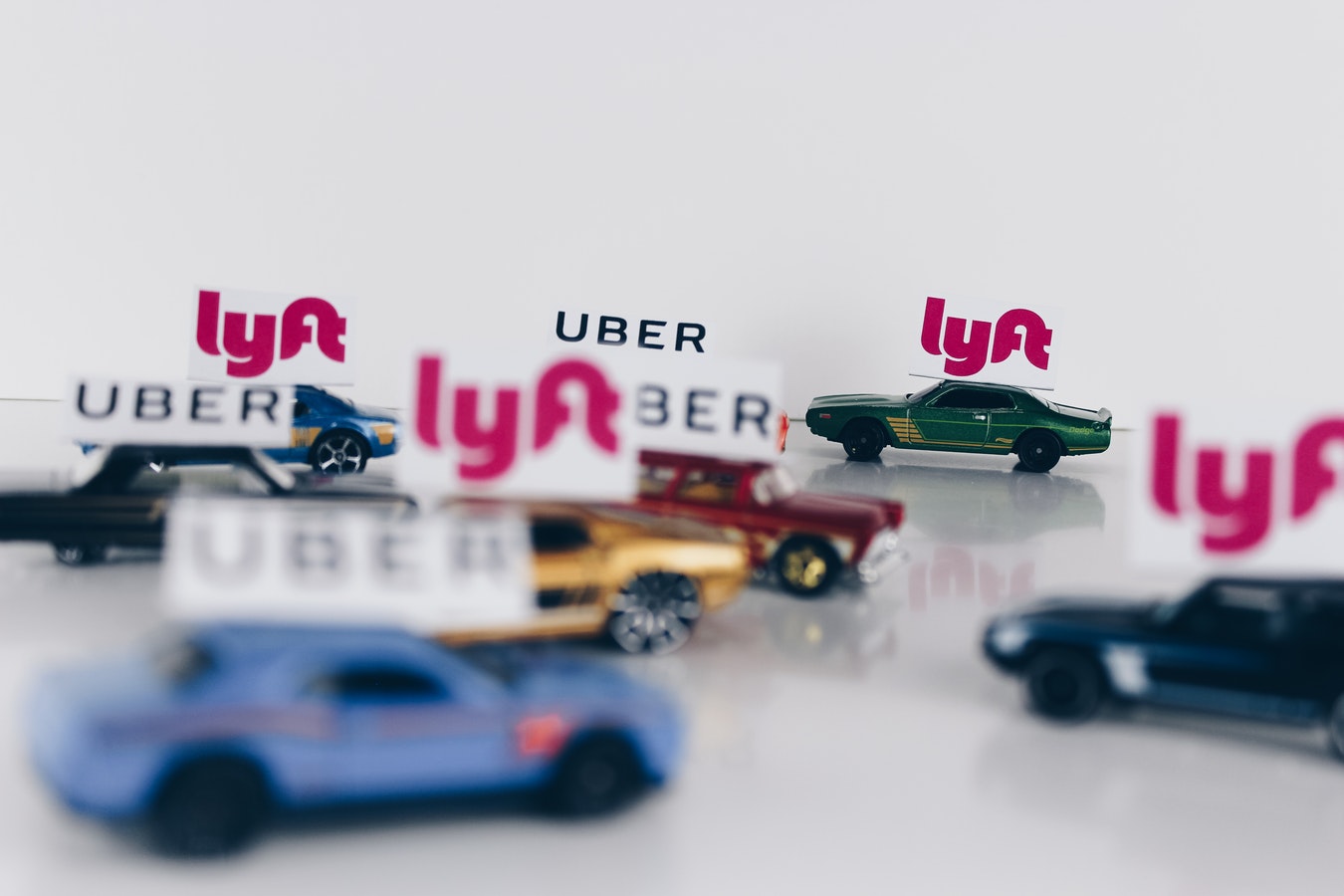 a group of toy cars with signs