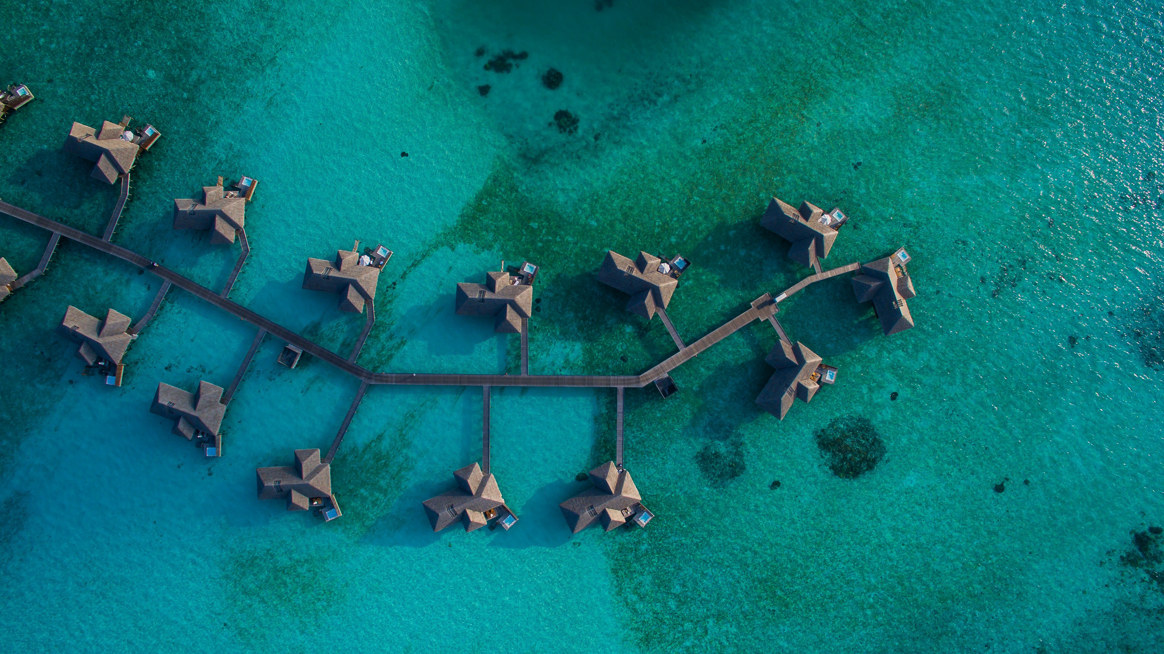 a group of huts on water