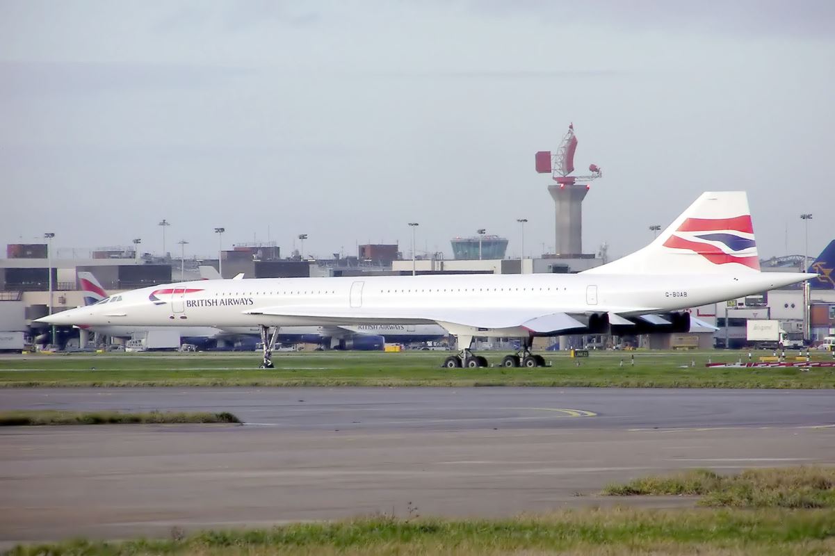 a large white airplane on a runway