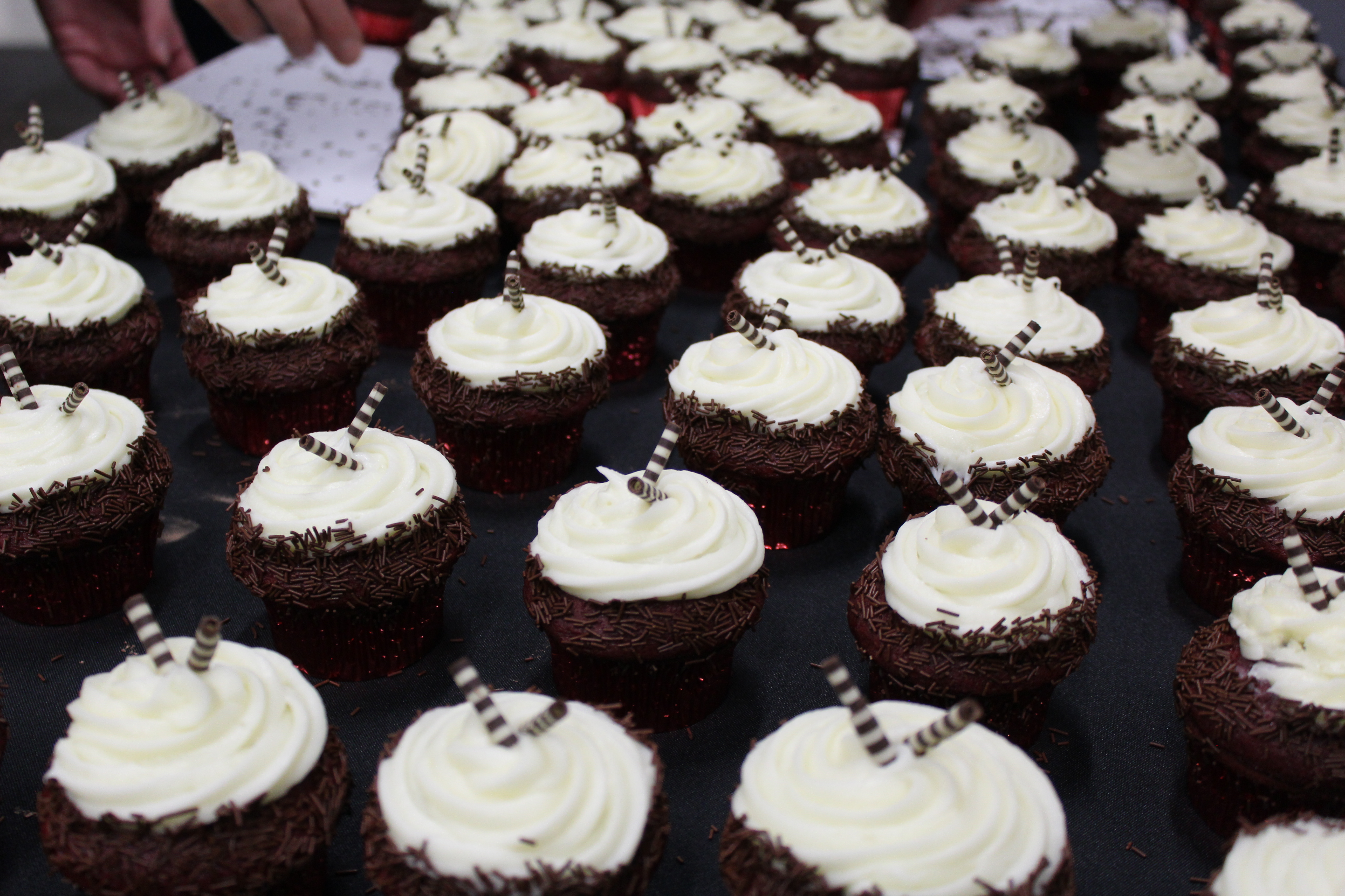 a group of cupcakes with white frosting