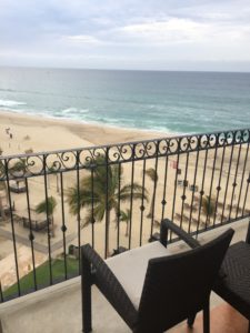 a balcony overlooking a beach