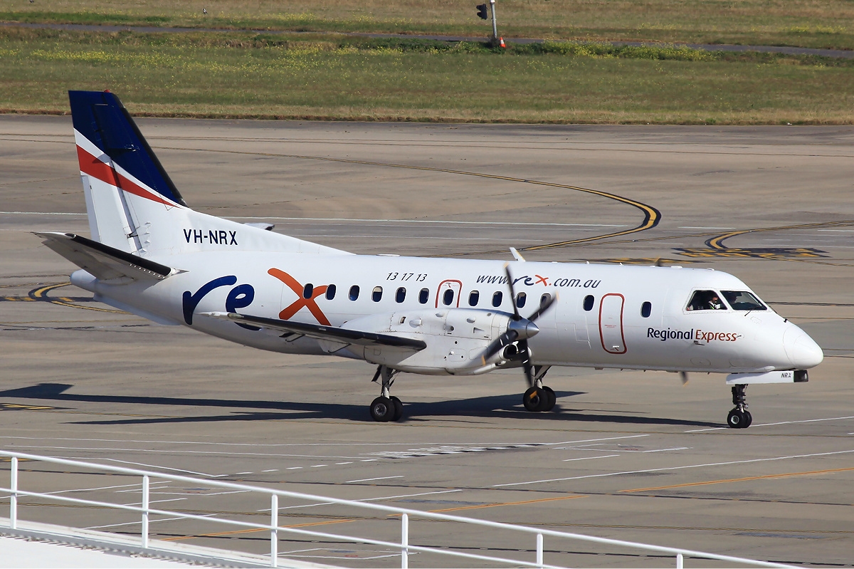 a white airplane on a runway