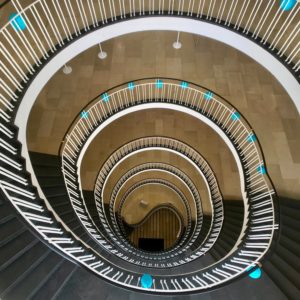 a spiral staircase with blue lights