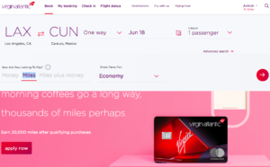 a credit card on a pink background