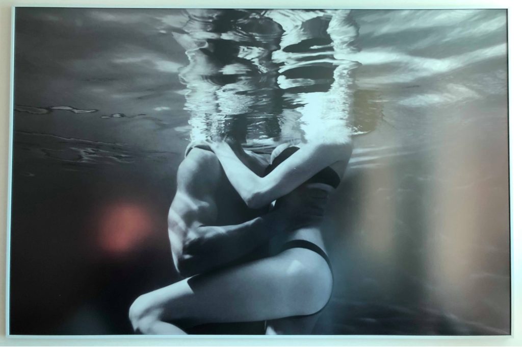 a man and woman hugging underwater