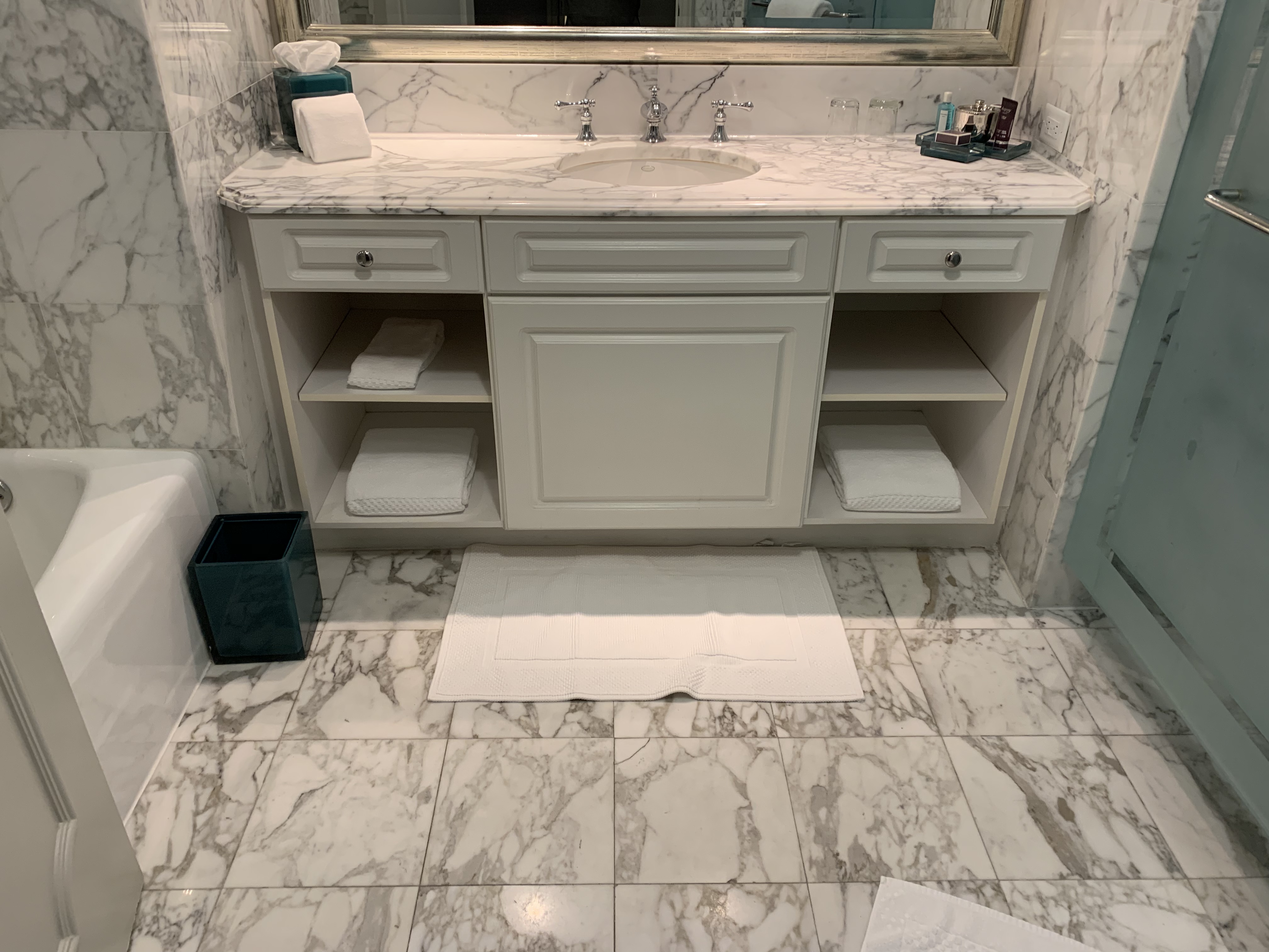 a bathroom with marble floor and a sink
