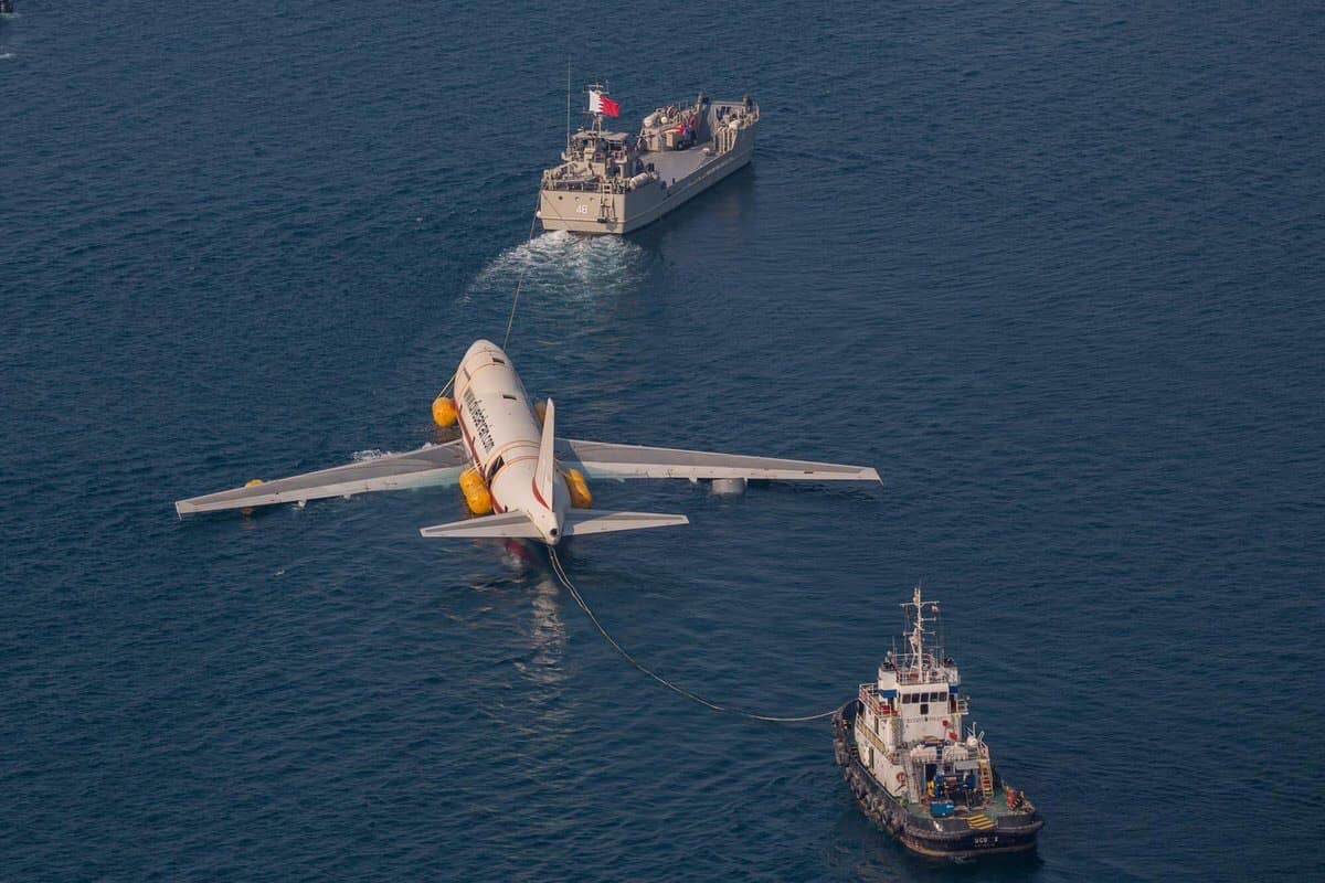 a plane and a boat in the water