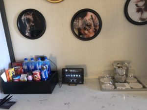 a counter with a tray of soda and drinks