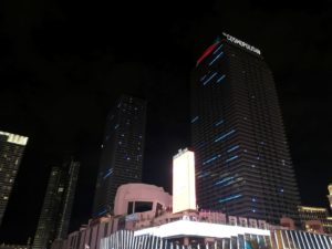 a group of tall buildings at night