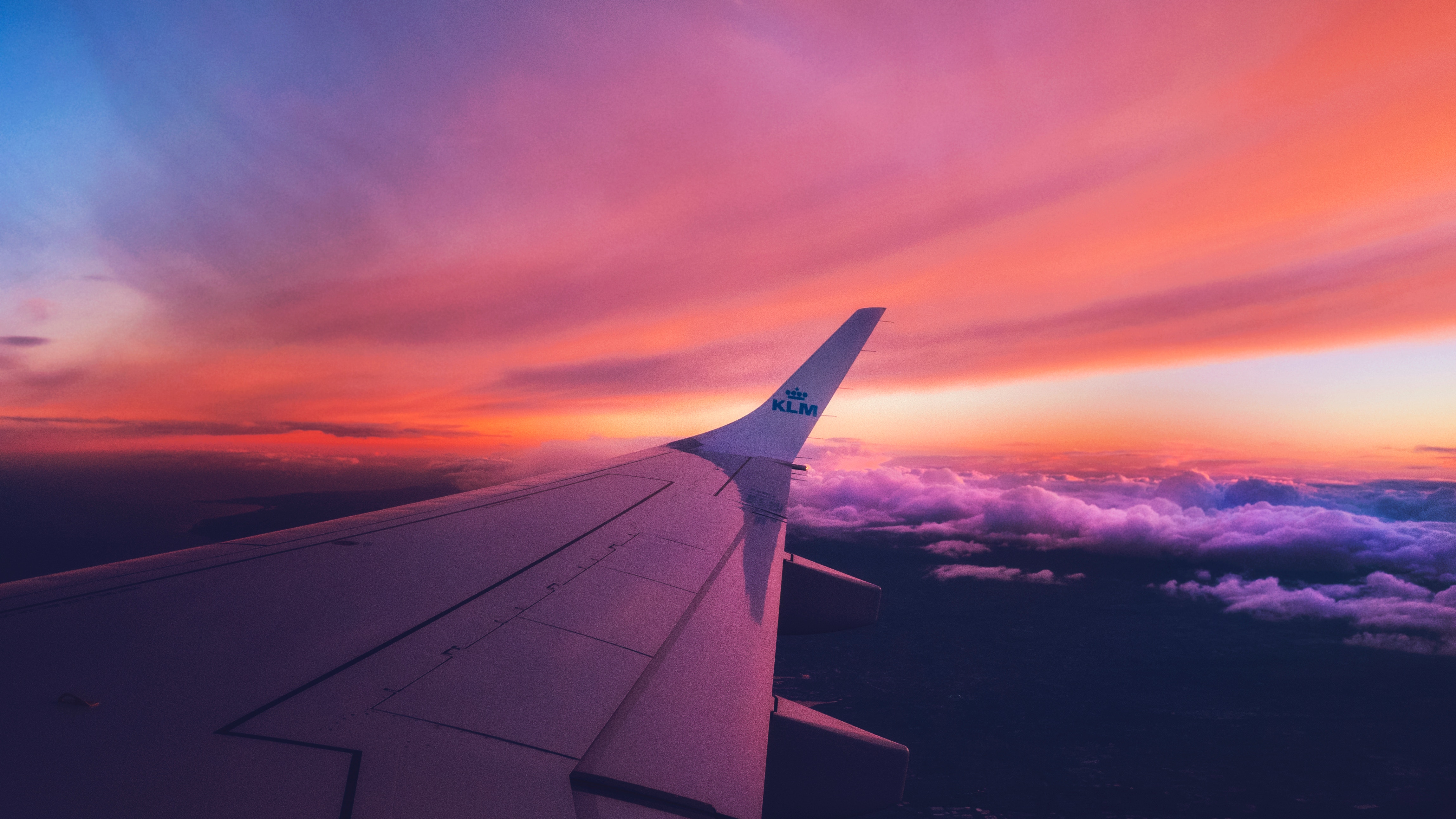 an airplane wing in the sky