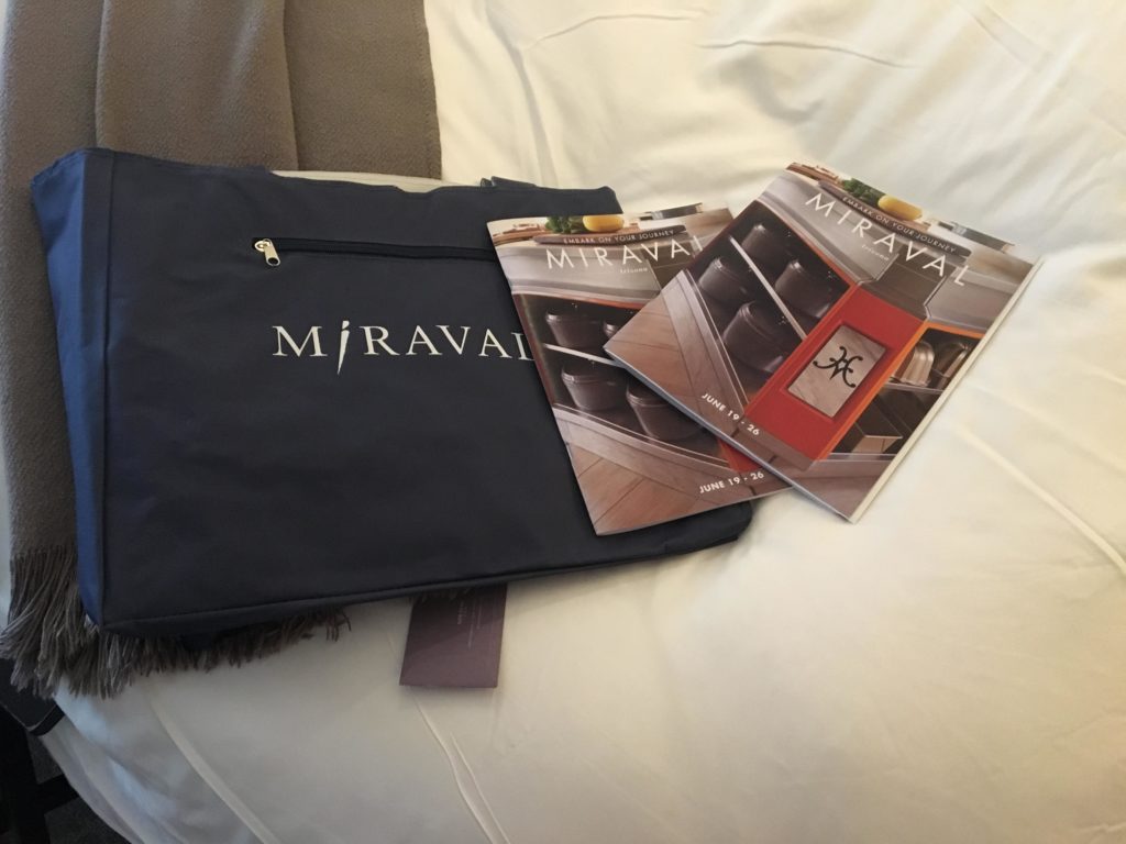 a blue bag with a couple magazines on it