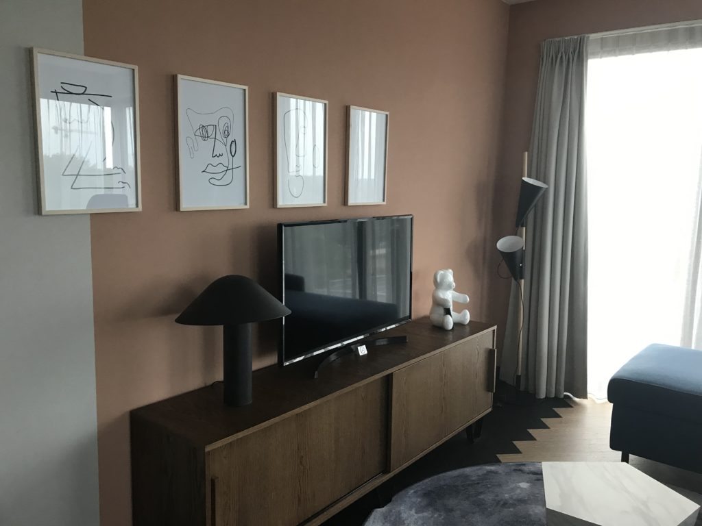 a tv on a cabinet in a room