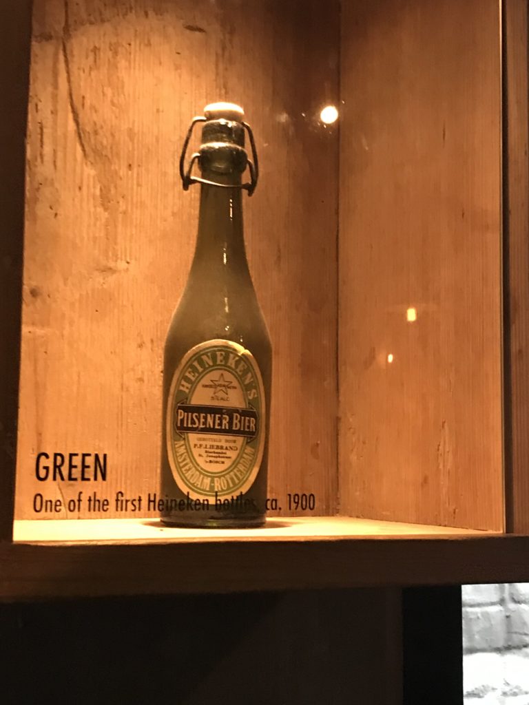 a bottle of beer in a wooden box
