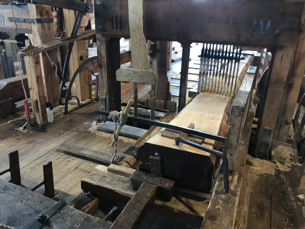 a woodworking machine with a wood beam