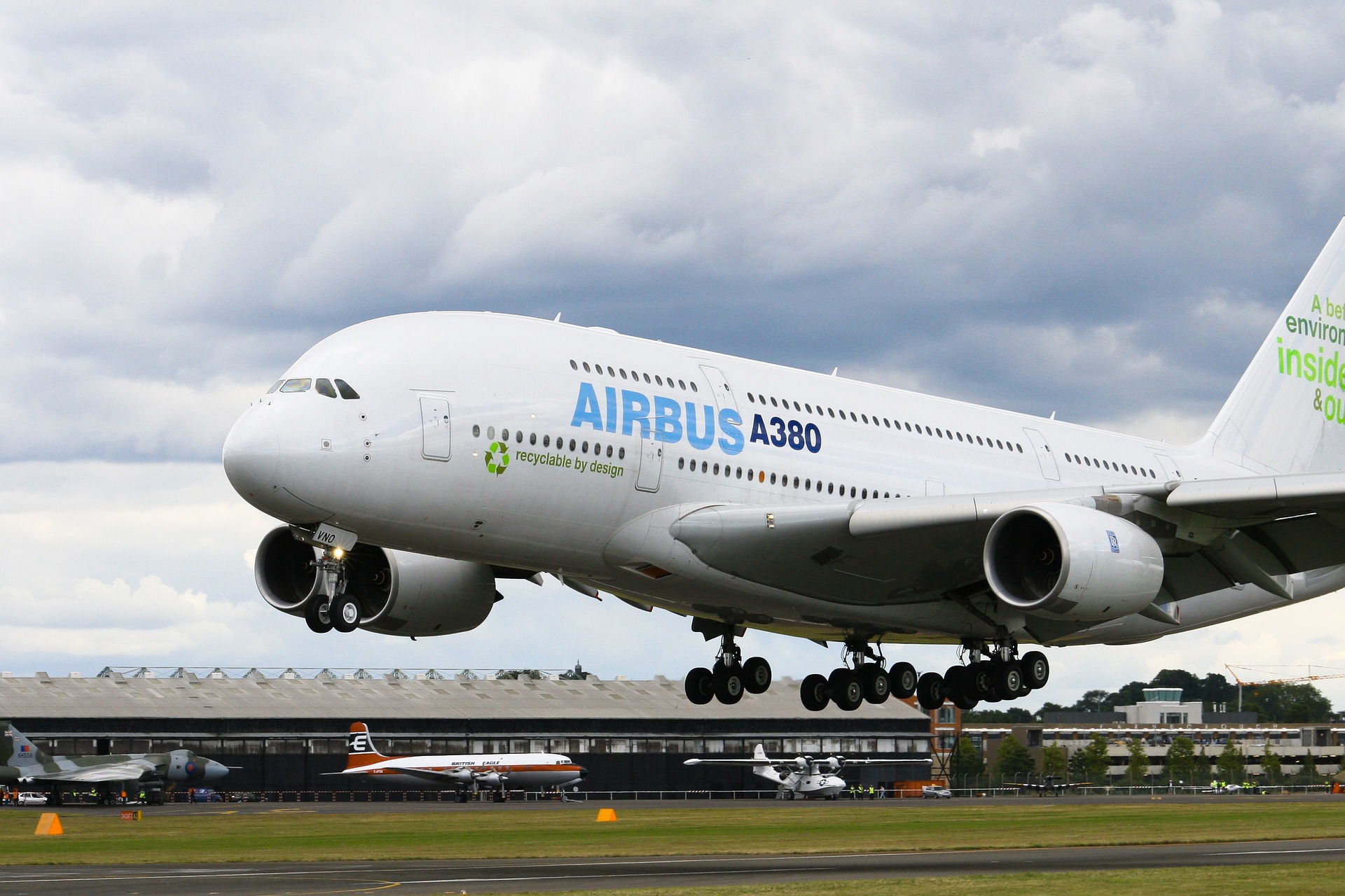 a large white airplane taking off