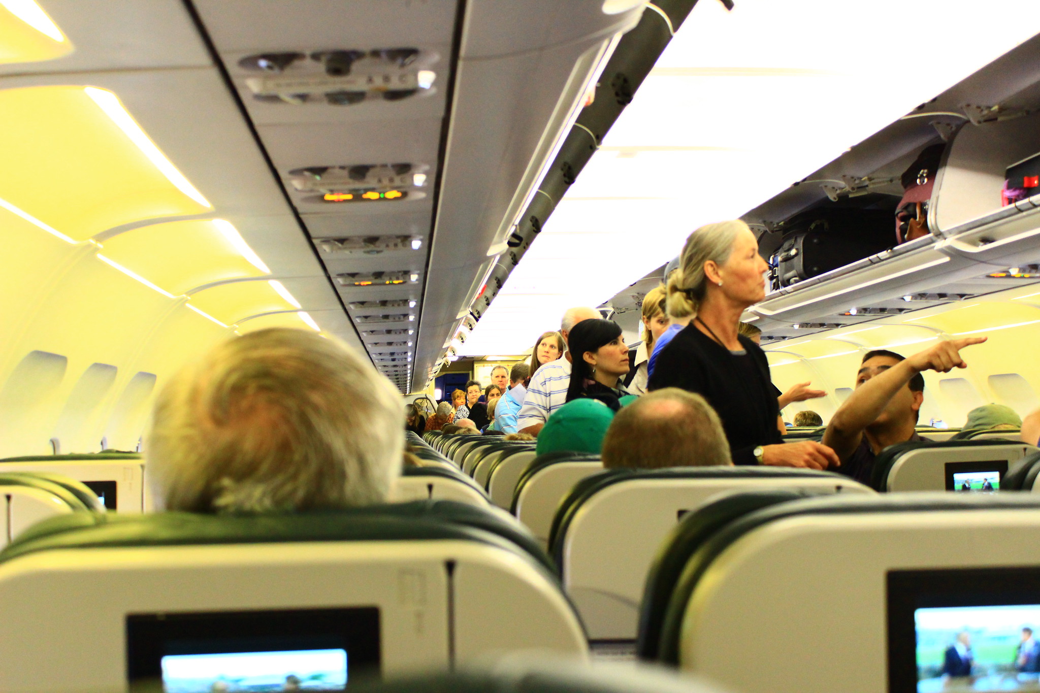 a group of people sitting in an airplane