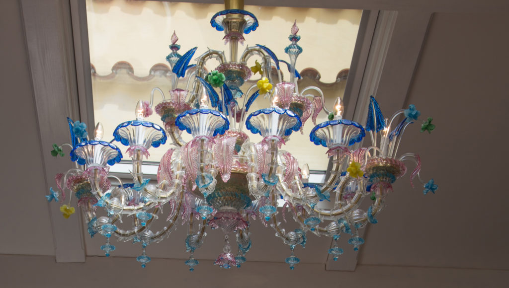 a chandelier with flowers and lights