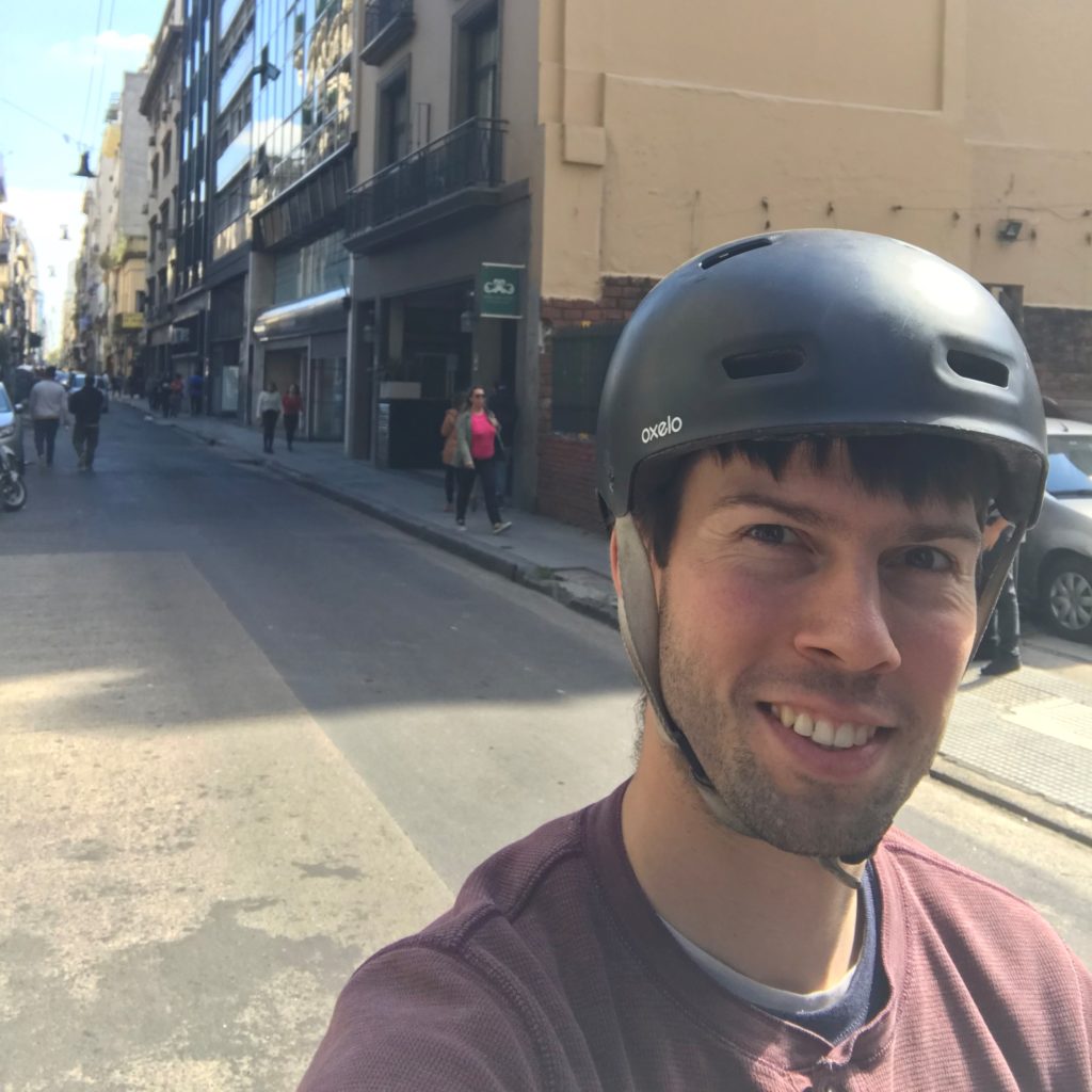a man wearing a helmet on a street
