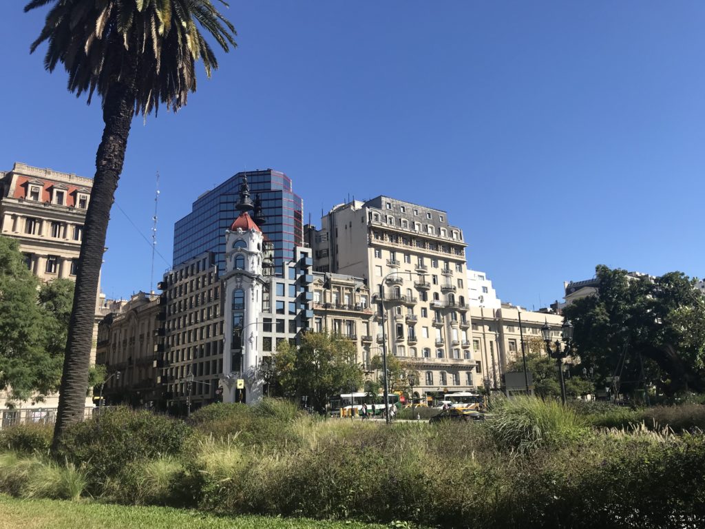 a city with tall buildings and trees