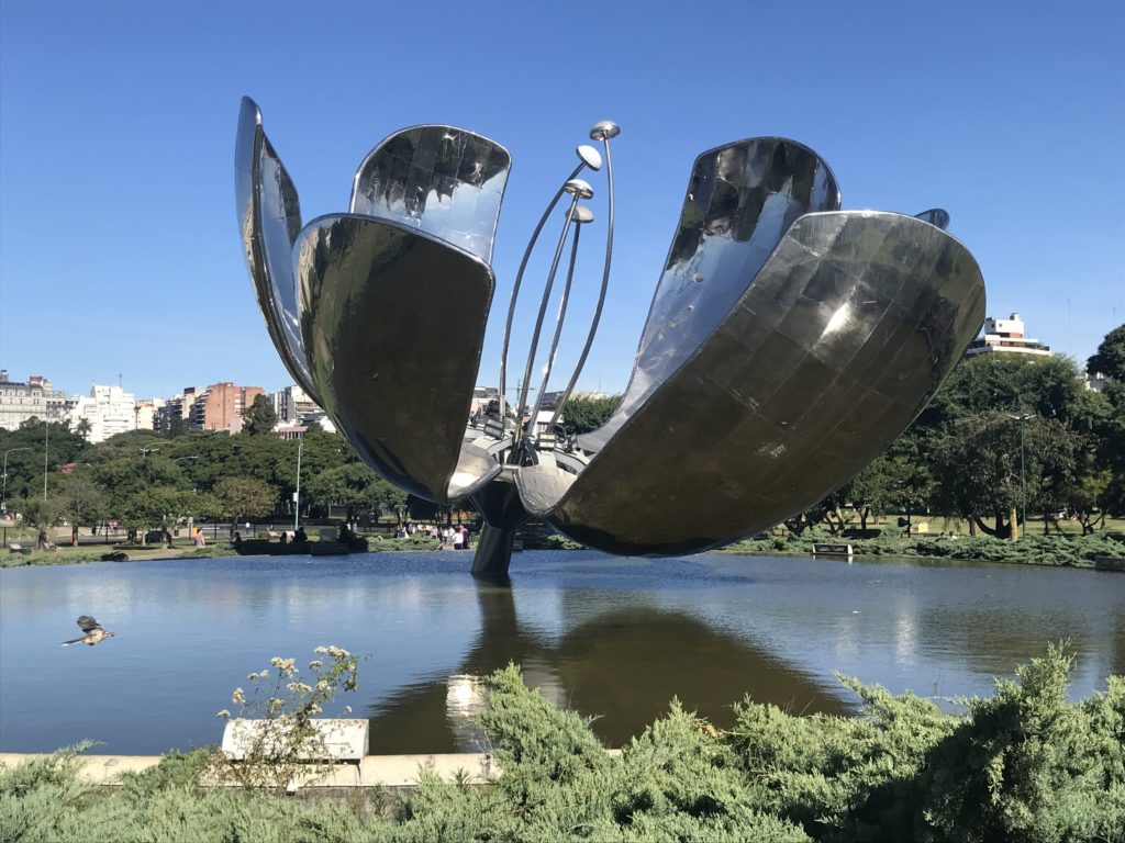 a metal sculpture in the water