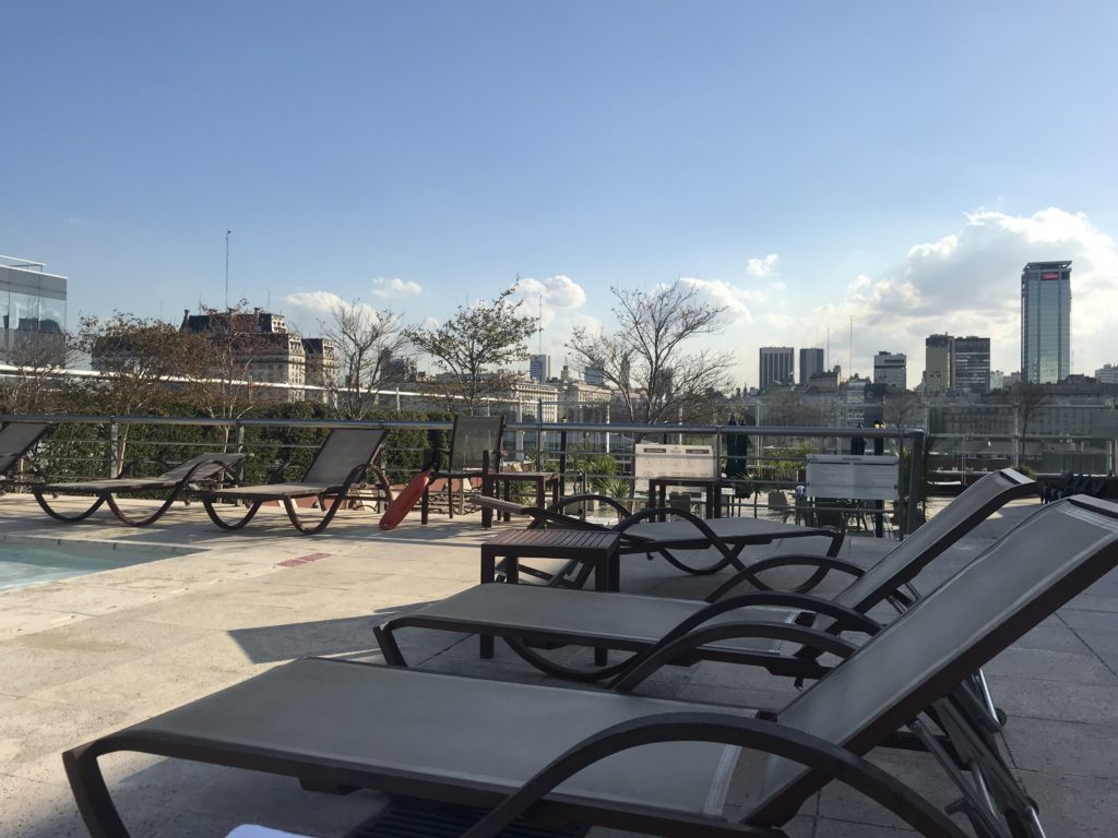 a group of chairs on a rooftop