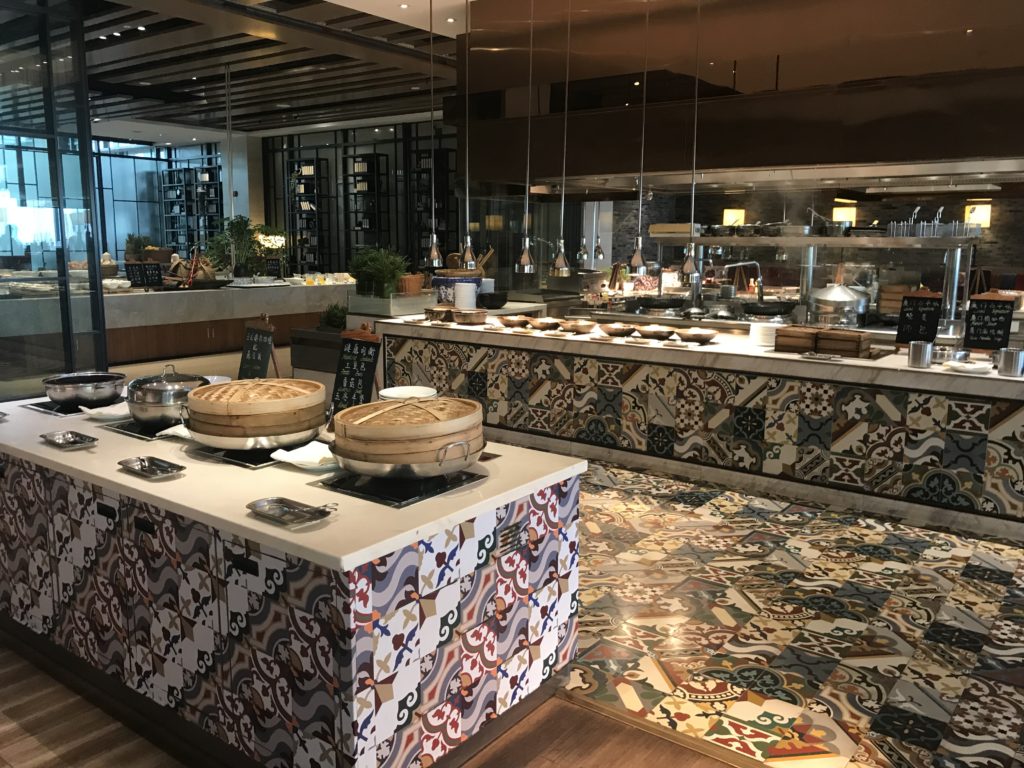 a restaurant with food on the counter