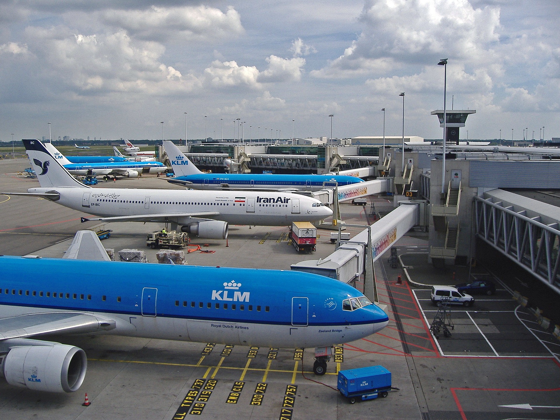 a group of airplanes at an airport