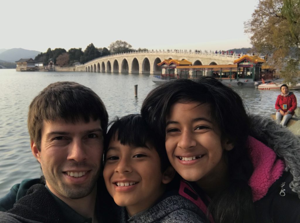 a man and two children taking a selfie