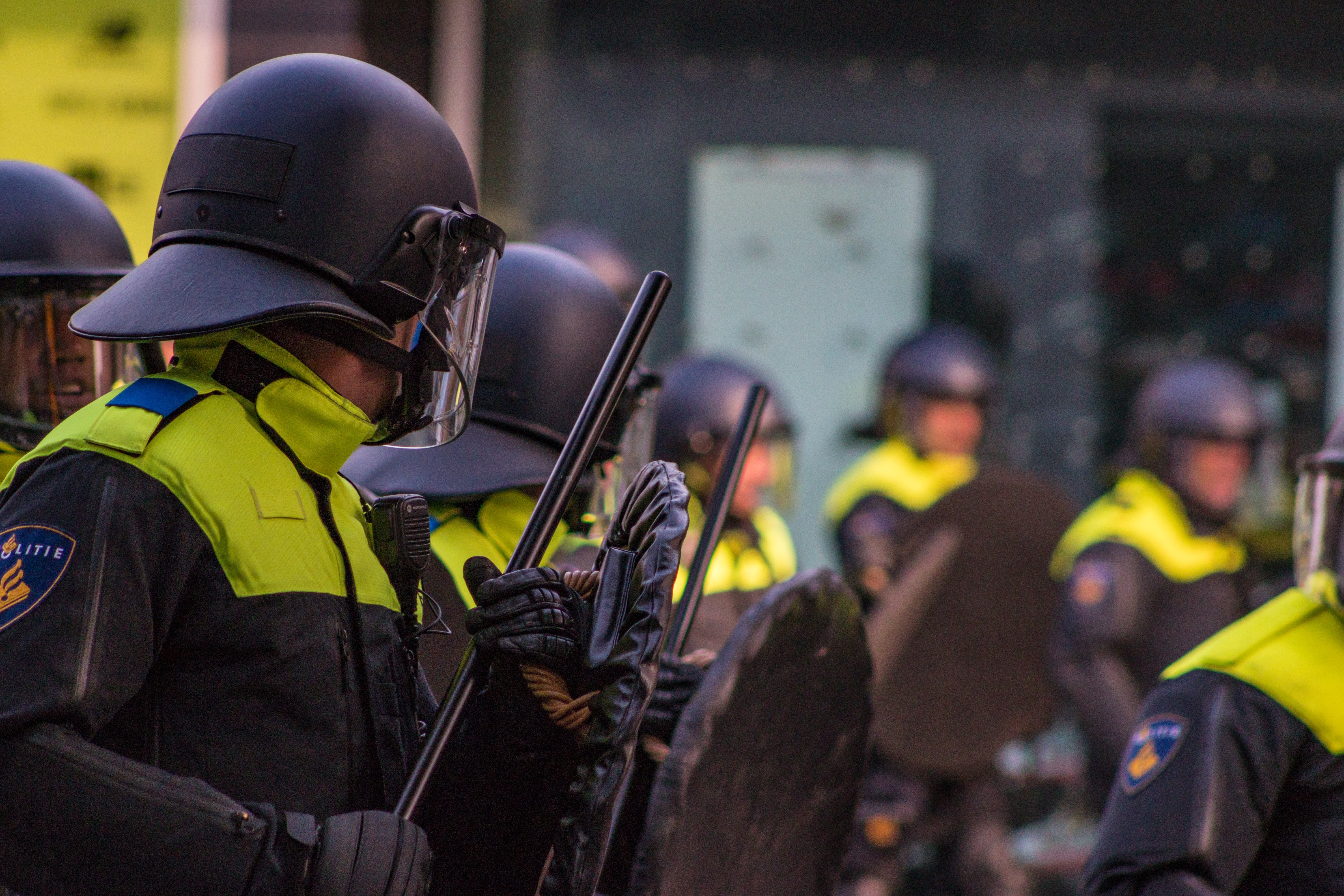 a group of people in uniform holding guns