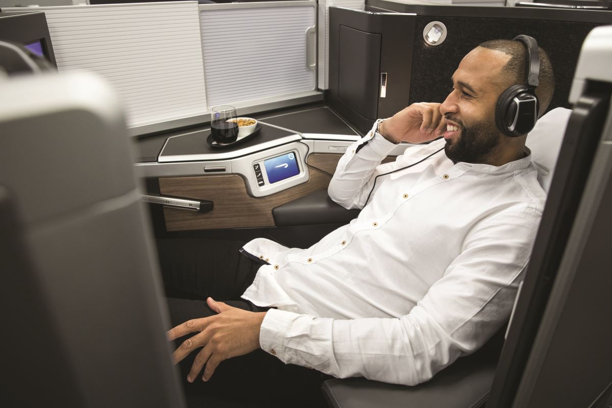 a man in a white shirt and headphones