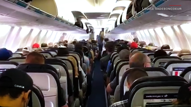 a group of people sitting in an airplane