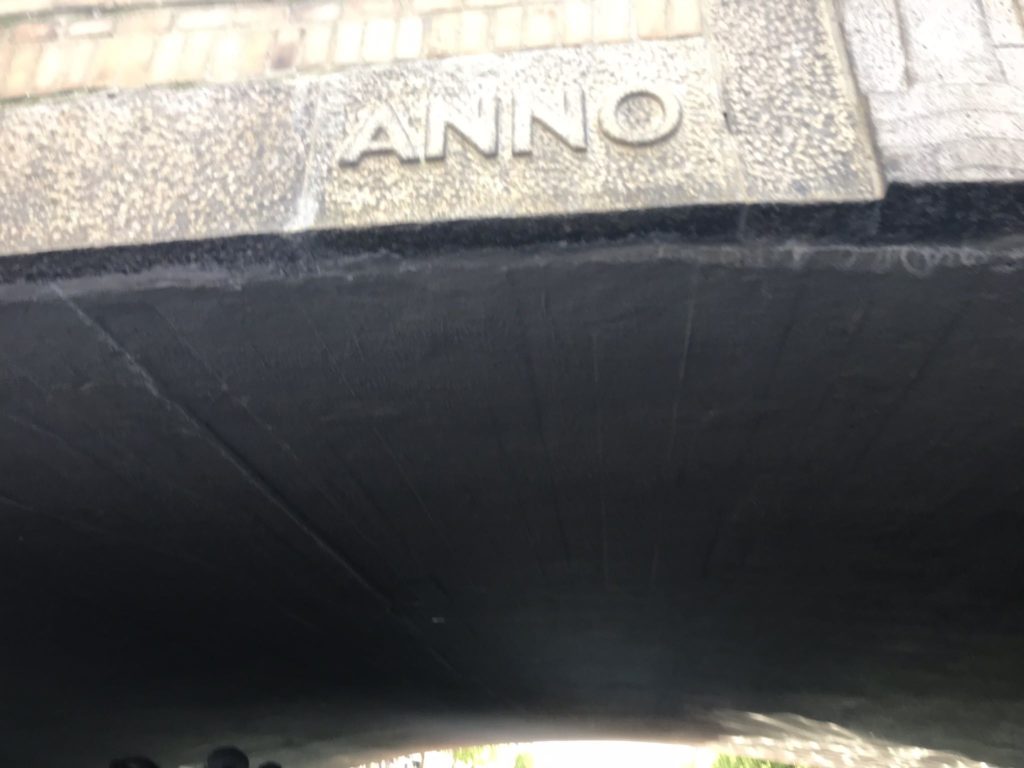 a stone bridge with text on it