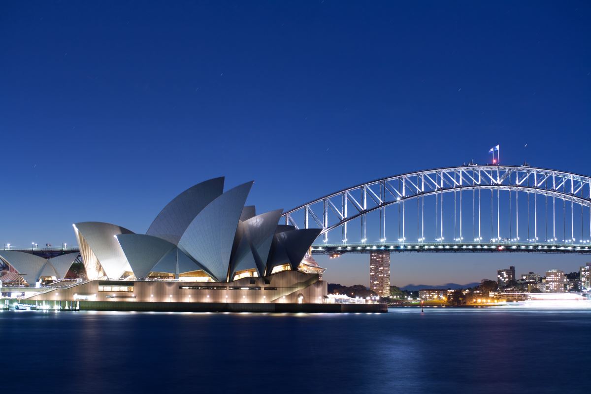 Sydney Opera House and a building at night