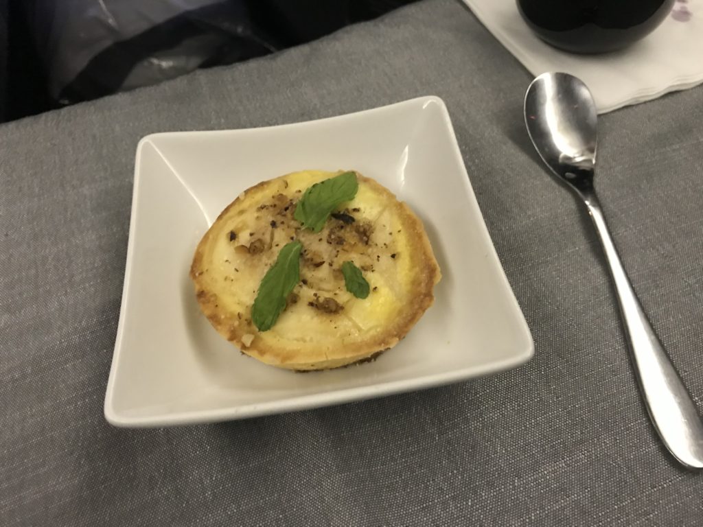 a small white plate with food on it